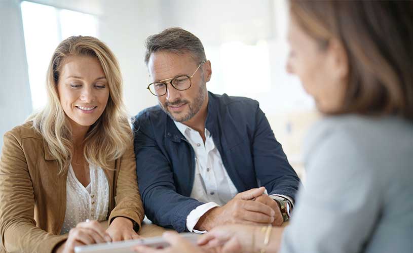 Advisor helping clients choose the right insurance